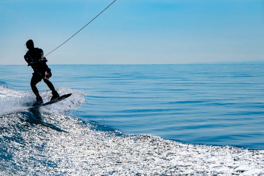 Jet ski rider carving across open water